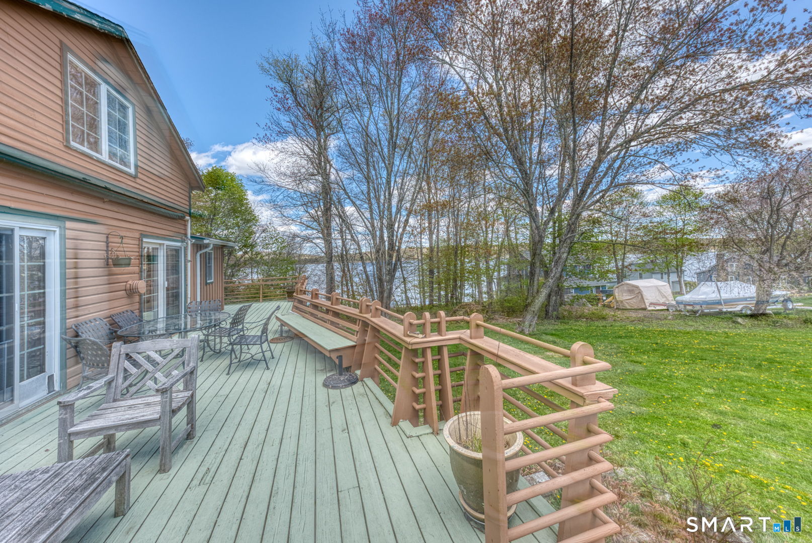 a view of a house with backyard and sitting area