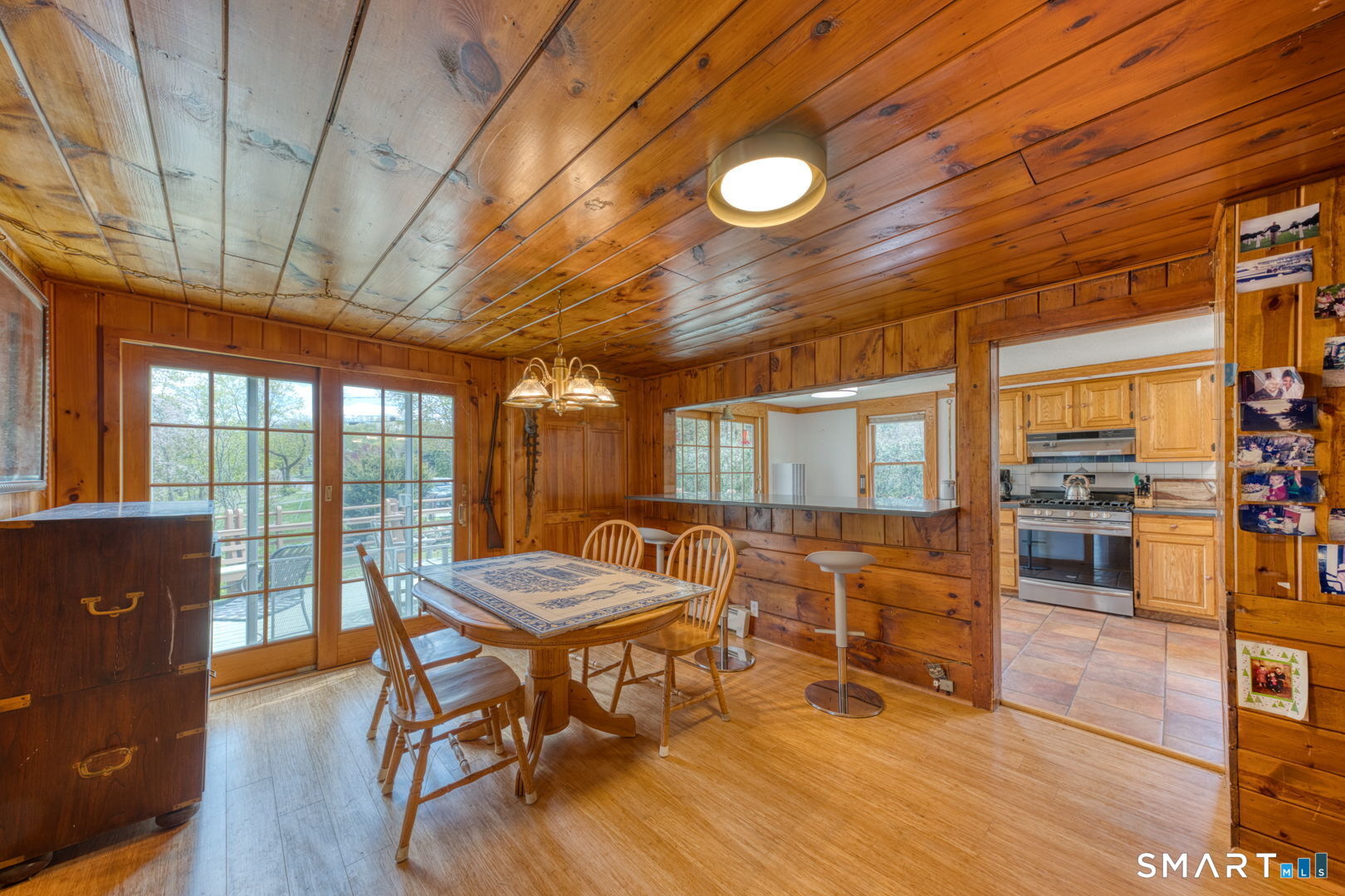 56 Tyler Lake Heights Road Goshen, CT 06756 - Photo 11 of 24 a view of a dining room with furniture window and wooden floor
