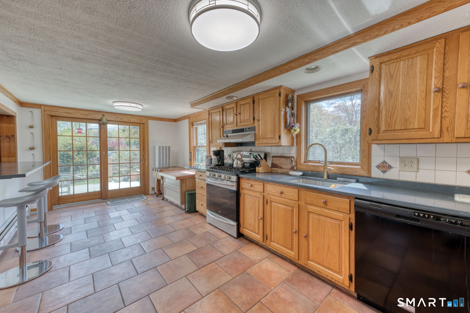 56 Tyler Lake Heights Road Goshen, CT 06756 - Photo 14 of 24 a large kitchen with cabinets