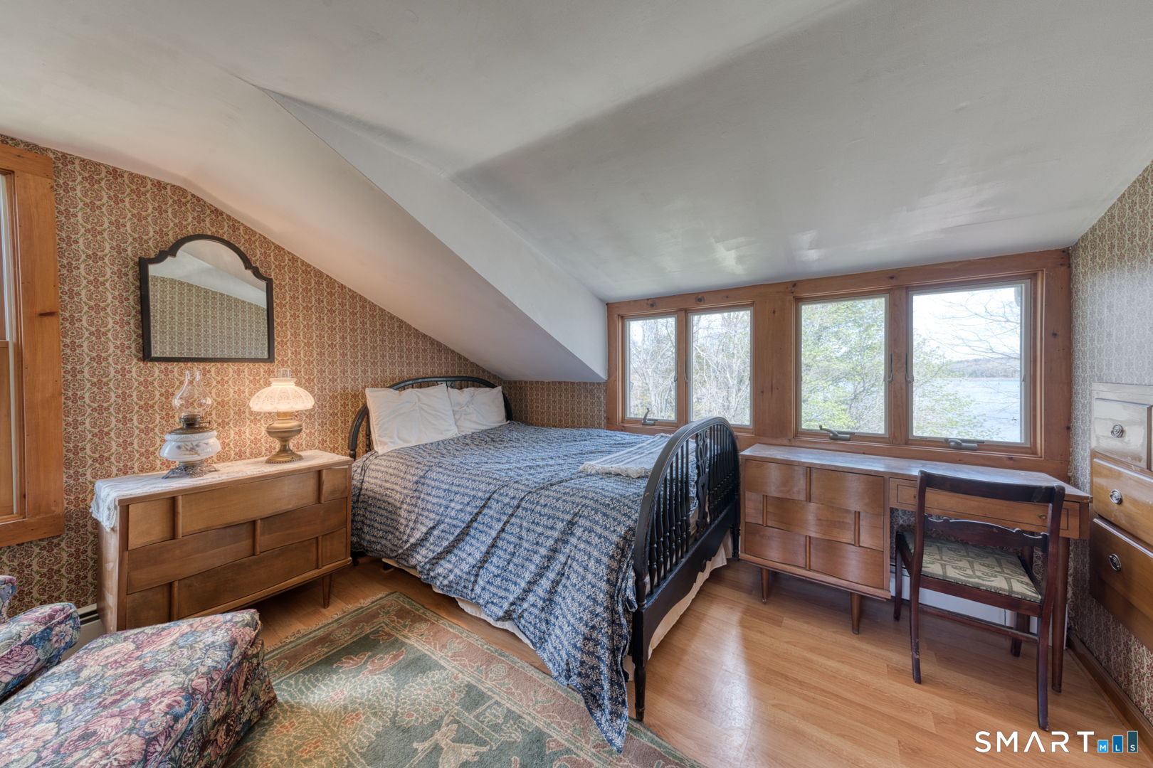 56 Tyler Lake Heights Road Goshen, CT 06756 - Photo 17 of 24 a bedroom with a large bed and a large window