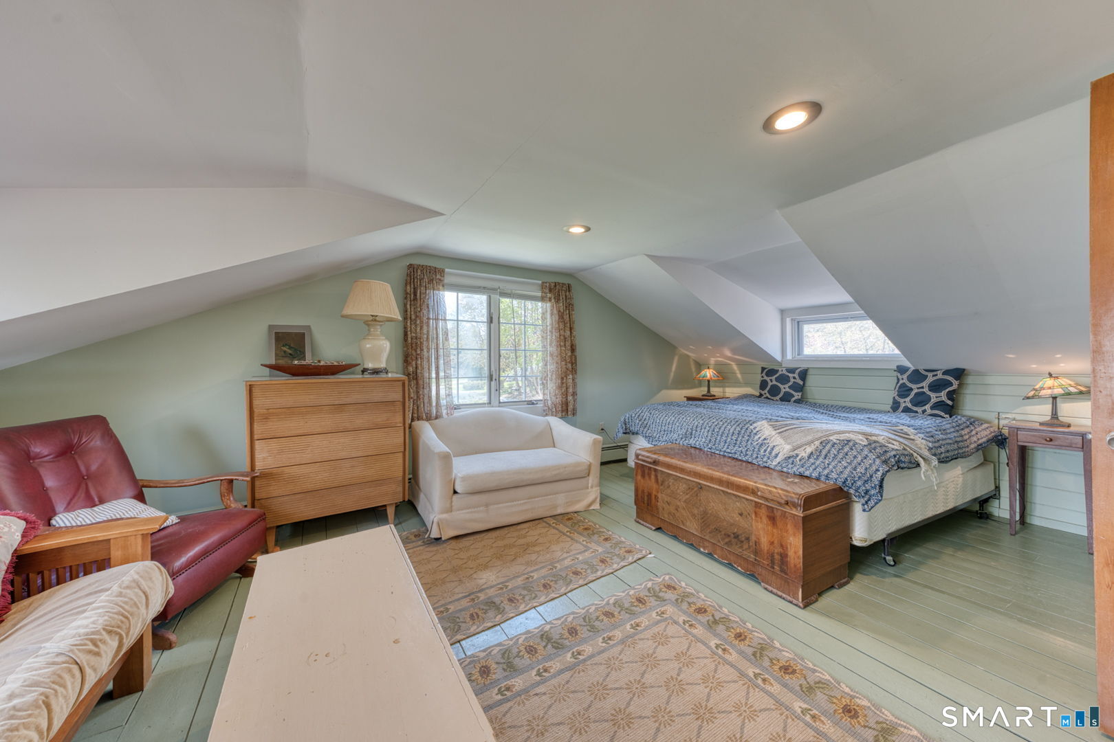 56 Tyler Lake Heights Road Goshen, CT 06756 - Photo 20 of 24 a spacious bedroom with a bed a couch and dresser