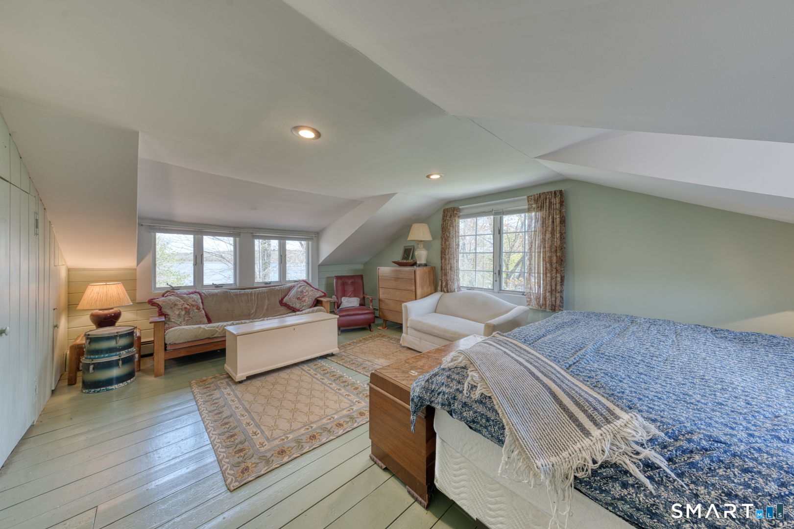 56 Tyler Lake Heights Road Goshen, CT 06756 - Photo 21 of 24 a spacious bedroom with a large bed and a couch