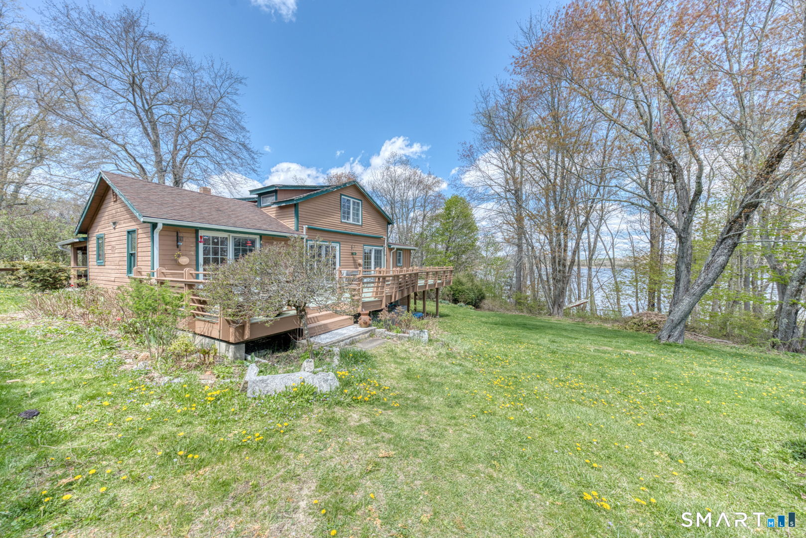 56 Tyler Lake Heights Road Goshen, CT 06756 - Photo 4 of 24 a front view of a house with yard and green space