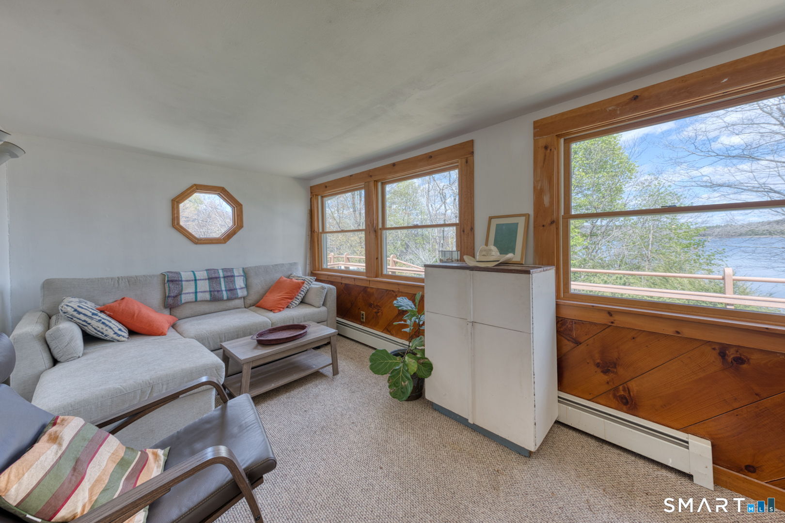 56 Tyler Lake Heights Road Goshen, CT 06756 - Photo 7 of 24 a living room with furniture and a large window