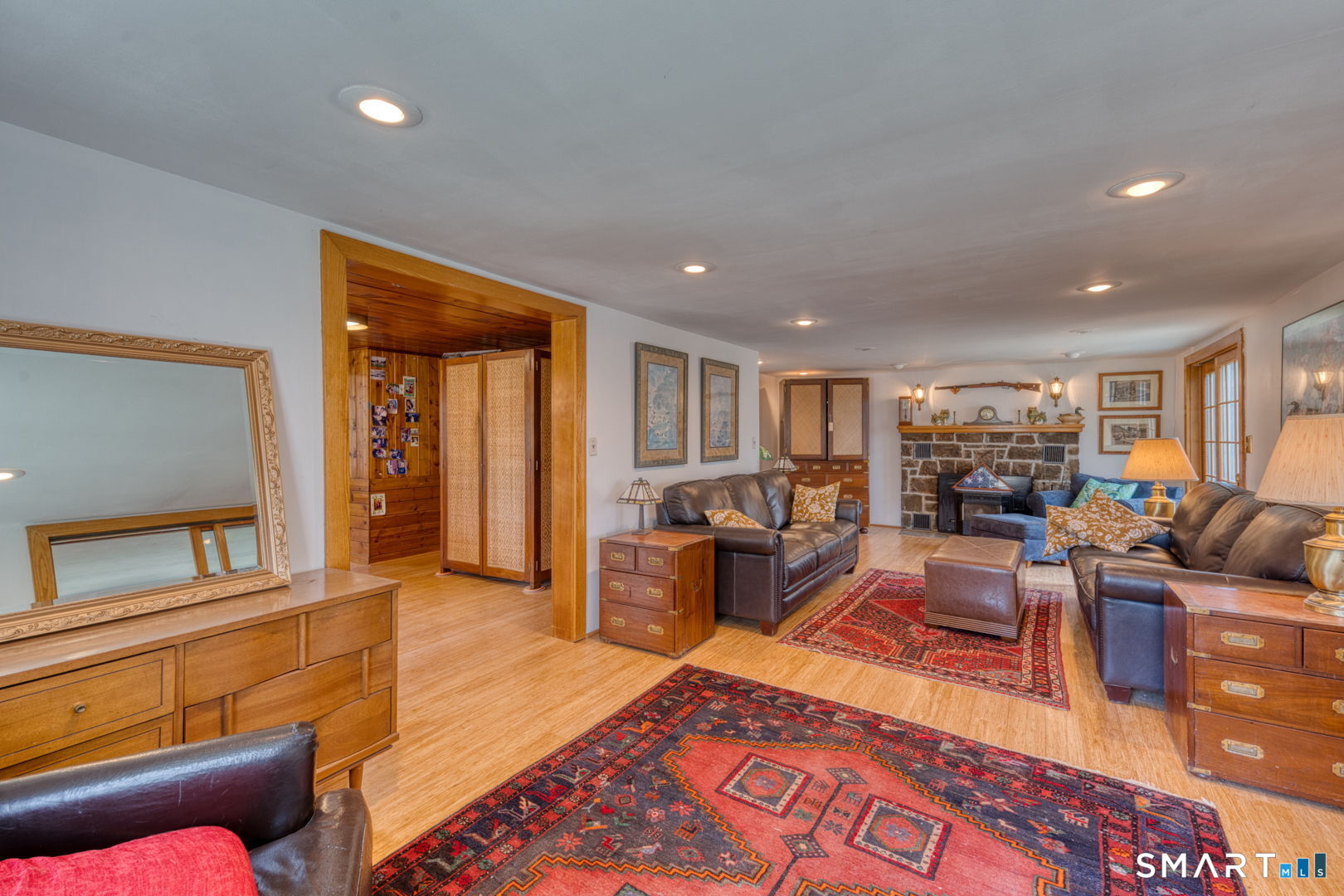 56 Tyler Lake Heights Road Goshen, CT 06756 - Photo 8 of 24 a living room with furniture and a flat screen tv