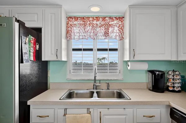 a kitchen with a sink and a window
