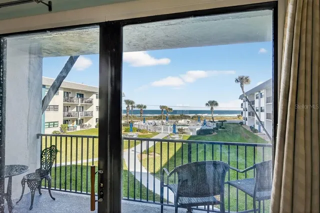 a view of a balcony with an ocean view