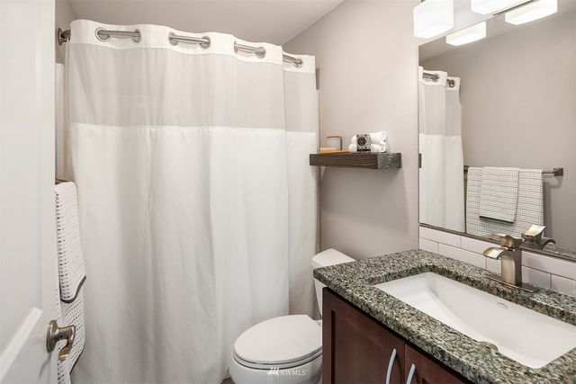 a view of a chairs and table on the deck