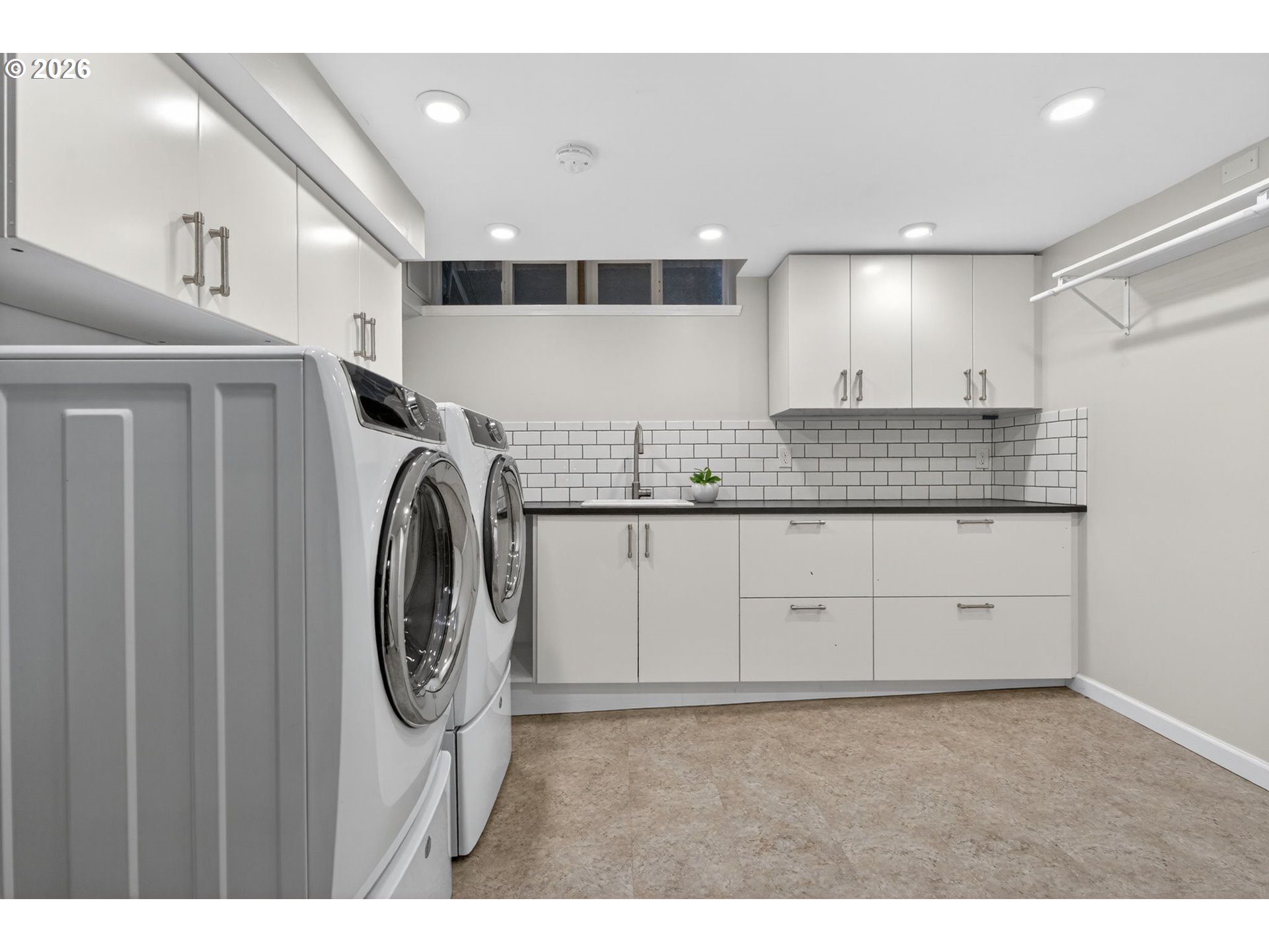 728 Northeast Royal Court Portland, OR 97232 - Photo 31 of 48 a bathroom with a sink a washer and dryer