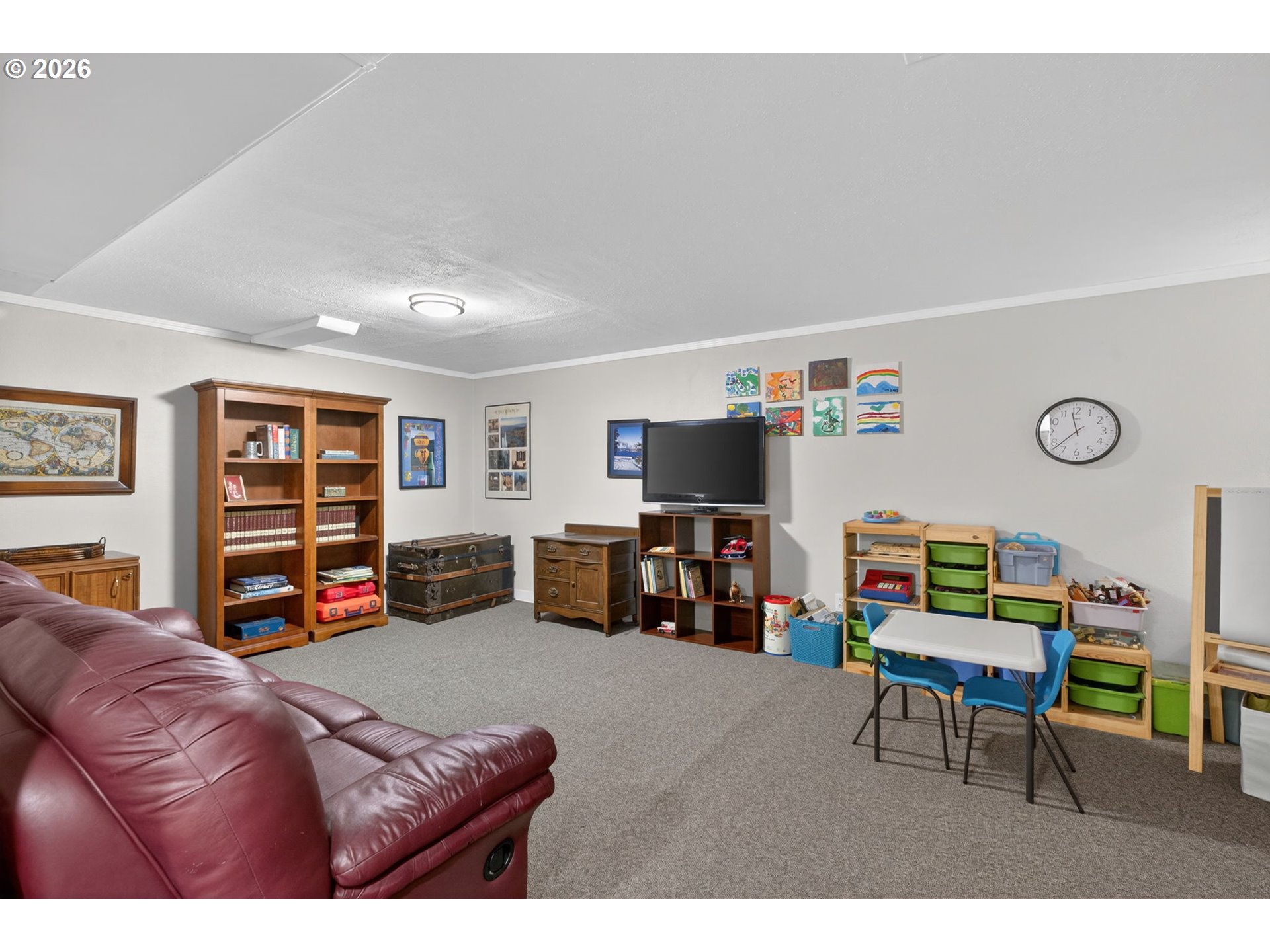 728 Northeast Royal Court Portland, OR 97232 - Photo 33 of 48 a living room with furniture and a flat screen tv