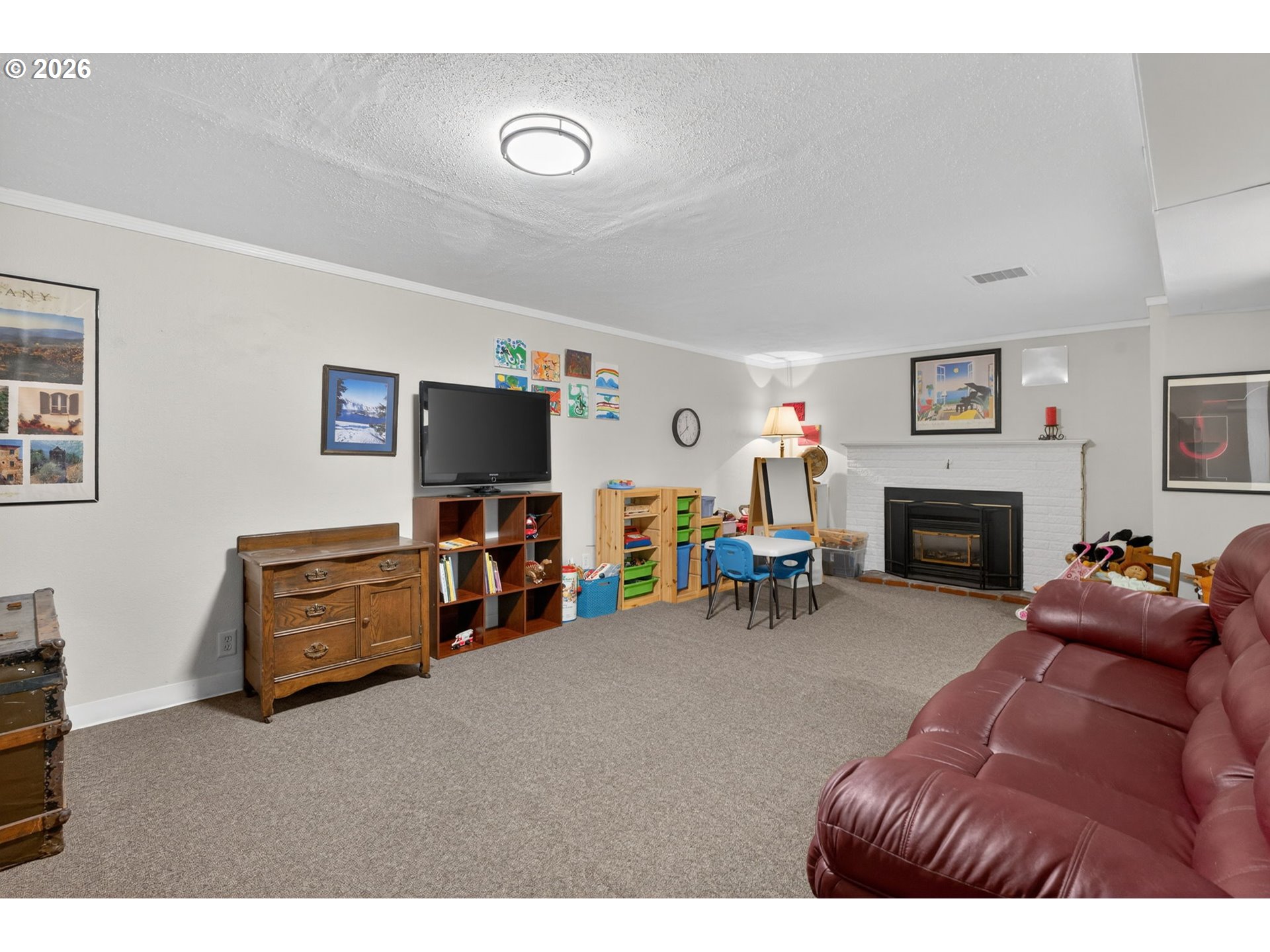 728 Northeast Royal Court Portland, OR 97232 - Photo 34 of 48 a living room with furniture and a fireplace