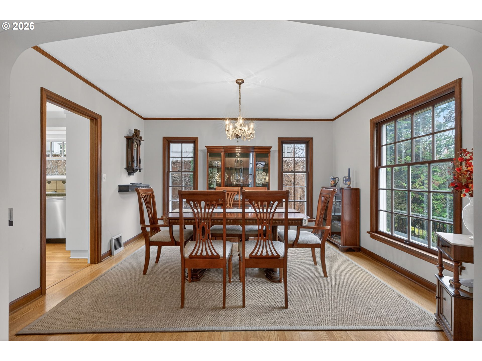 728 Northeast Royal Court Portland, OR 97232 - Photo 6 of 48 a dining room with furniture a chandelier and wooden floor
