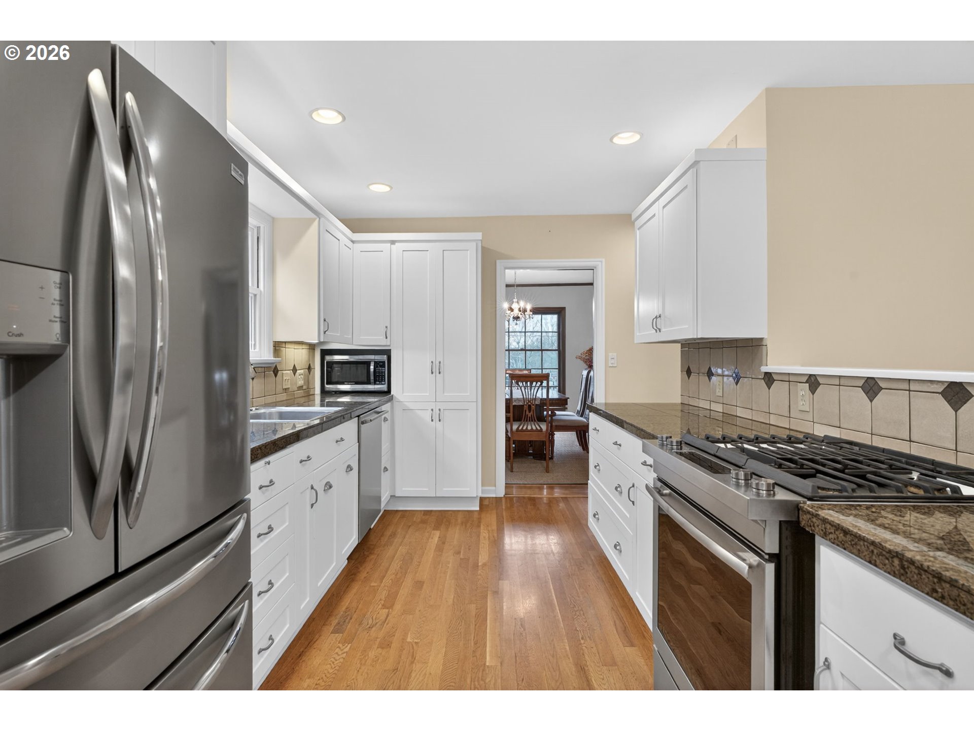 728 Northeast Royal Court Portland, OR 97232 - Photo 9 of 48 a kitchen with stainless steel appliances granite countertop a stove a sink and a refrigerator