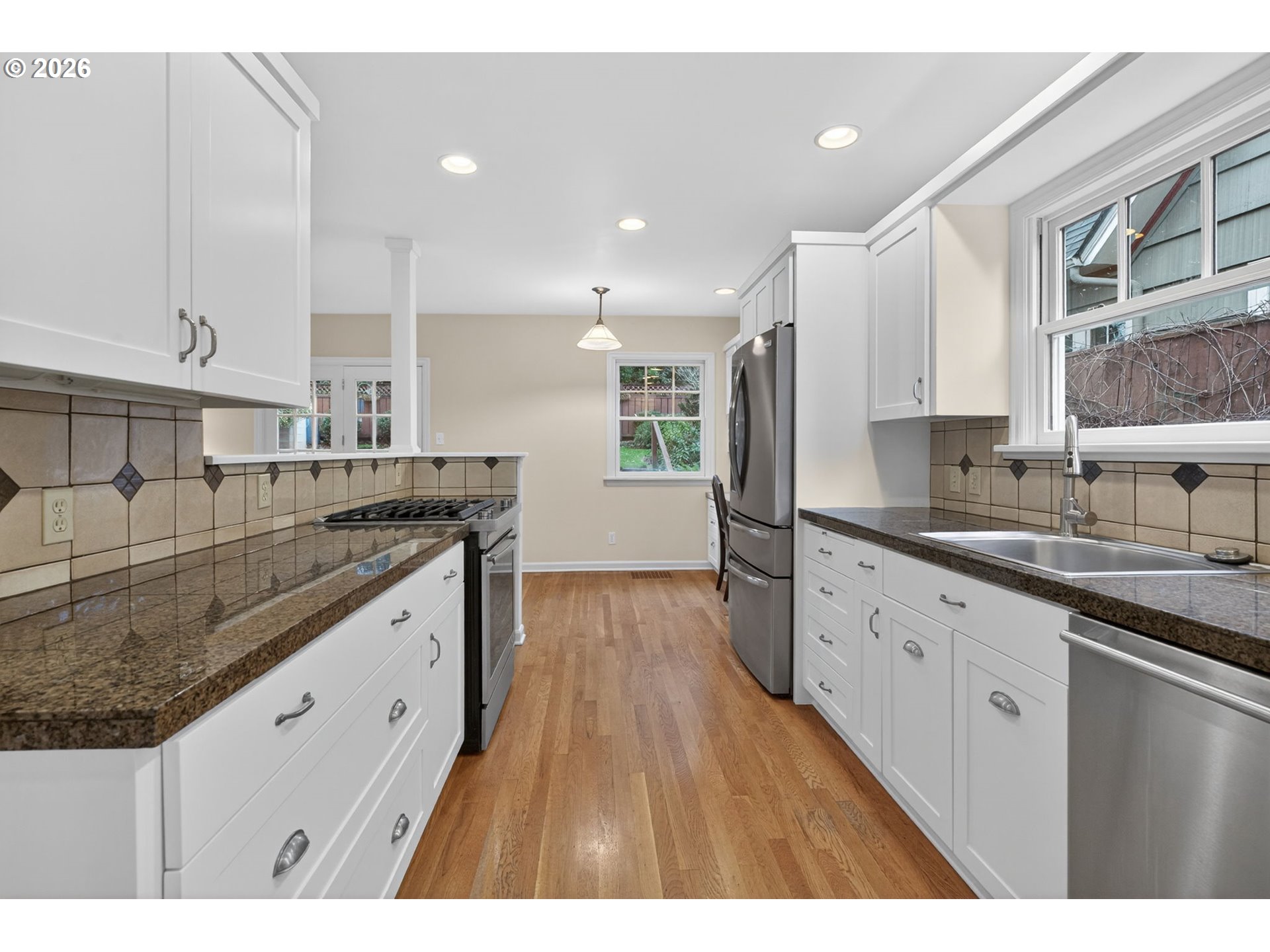 728 Northeast Royal Court Portland, OR 97232 - Photo 10 of 48 a kitchen with granite countertop a sink and cabinets