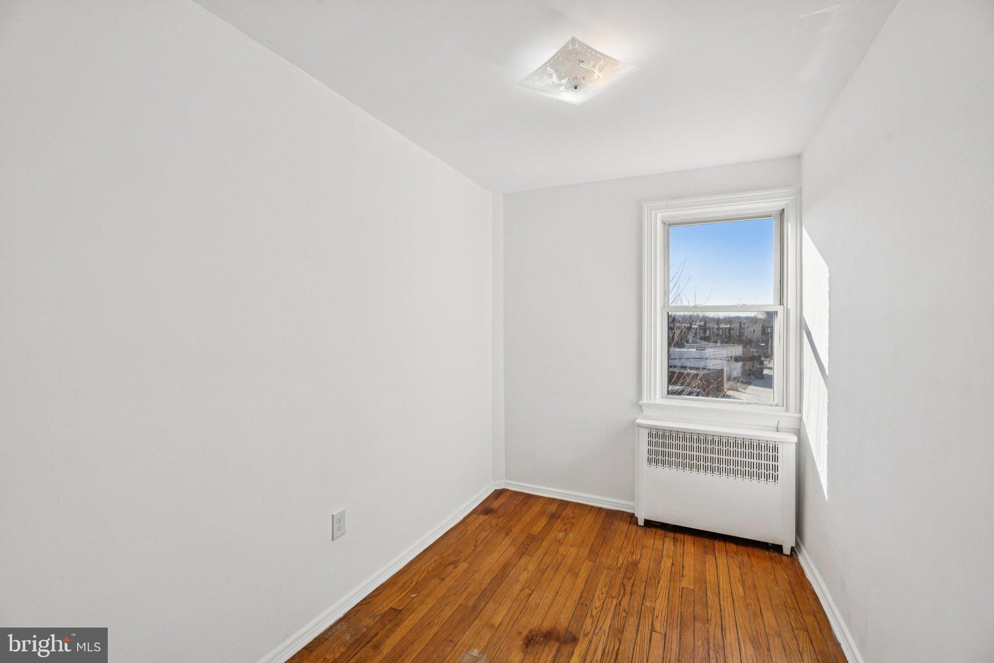 2521 Benning Road Northeast Washington, DC 20002 - Photo 14 of 22 Bright and airy room with hardwood floors.