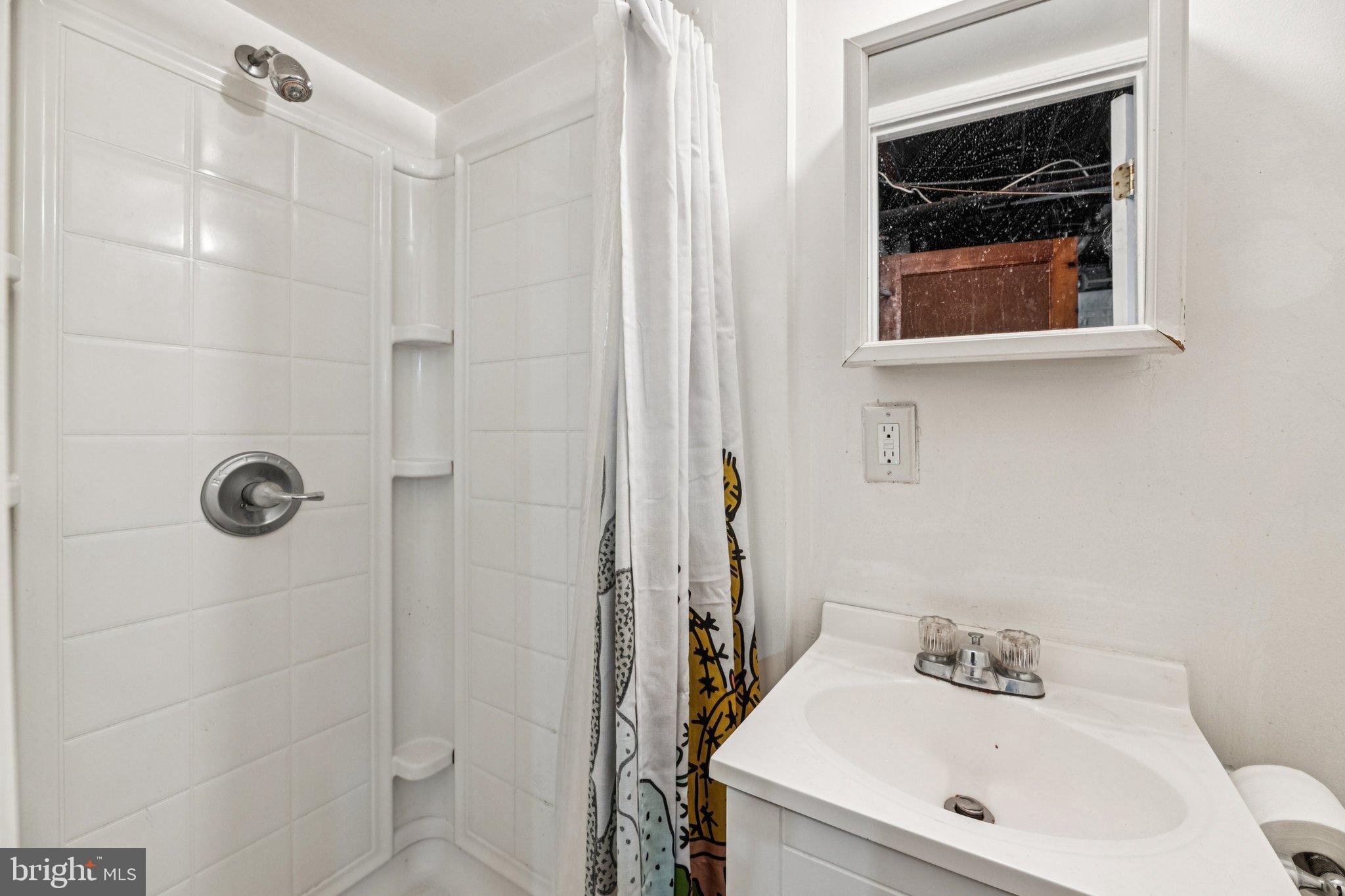 2521 Benning Road Northeast Washington, DC 20002 - Photo 16 of 22 Bright and functional bathroom