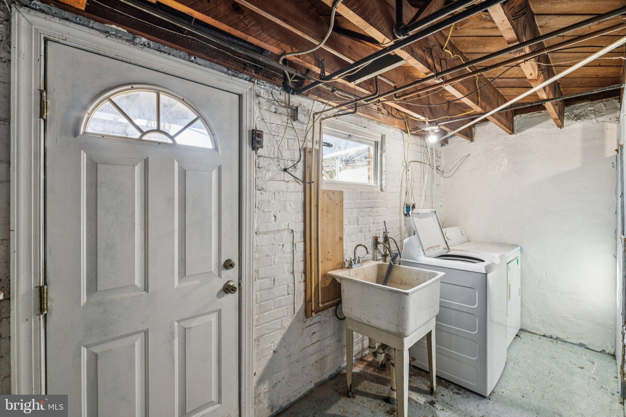 2521 Benning Road Northeast Washington, DC 20002 - Photo 19 of 22 Bright and functional basement laundry space.