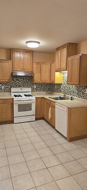 403 South Main Street, Unit 1 Sharon, MA 02067 - Photo 7 of 16 a kitchen with stainless steel appliances granite countertop a stove a sink and a refrigerator