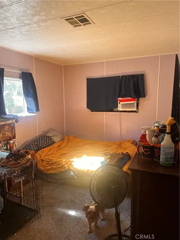 a bedroom with a bed and furniture