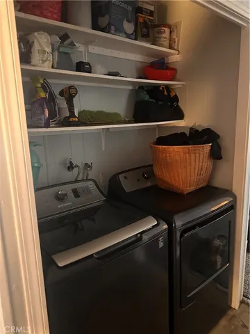 a close view of water heater and wooden cabinets