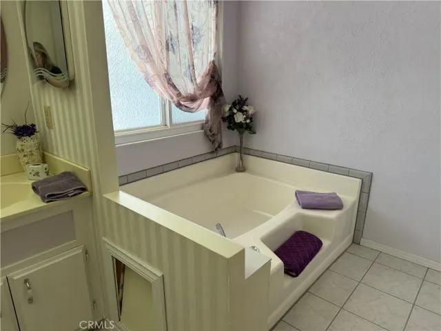 a room that has a bed and a window