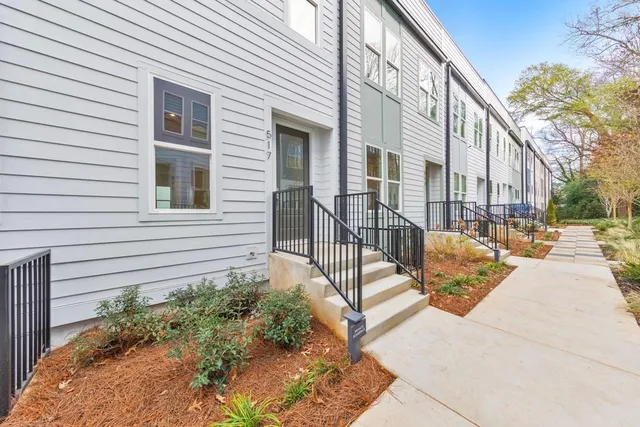 a view of a house with a bench in patio
