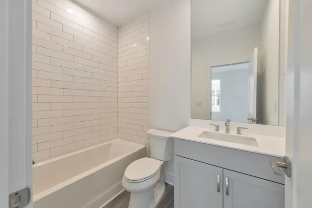 a bathroom with a sink toilet and bathtub
