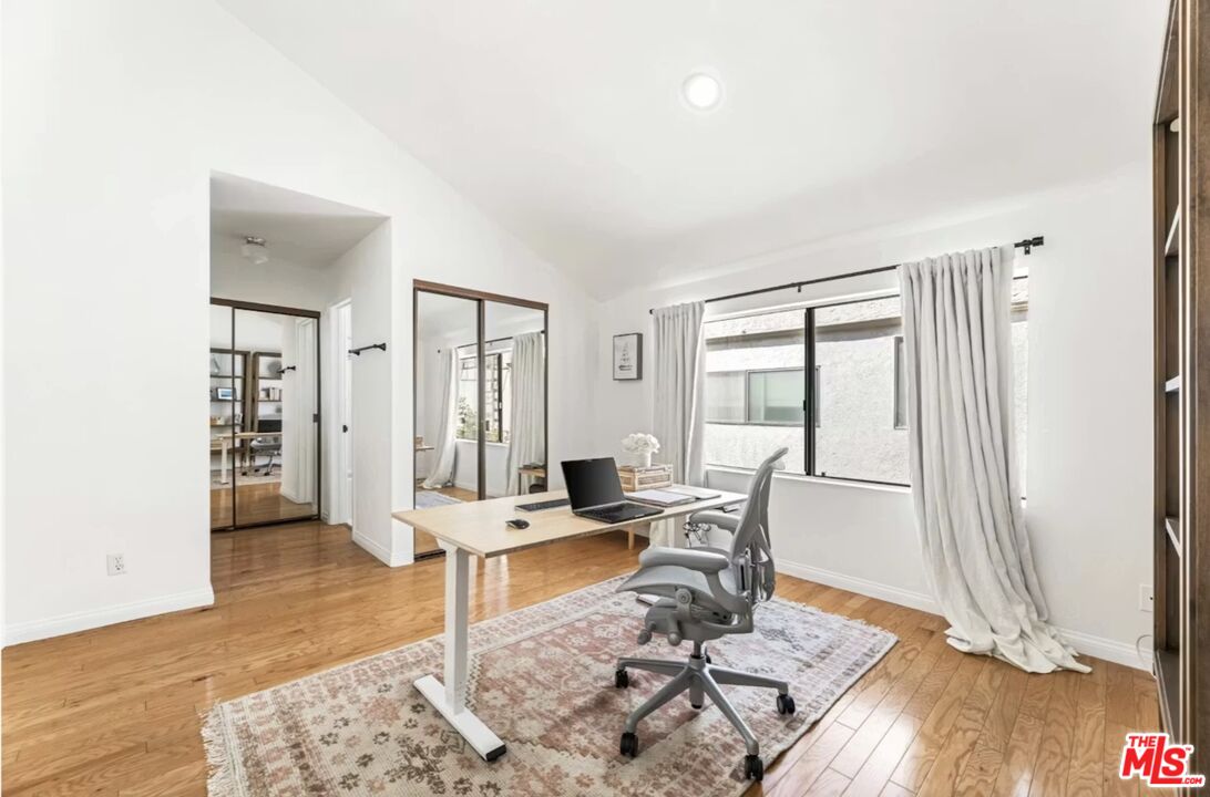 1108 18th Street, Unit 5 Santa Monica, CA 90403 - Photo 11 of 11 a living room with furniture a wooden floor and next to a window