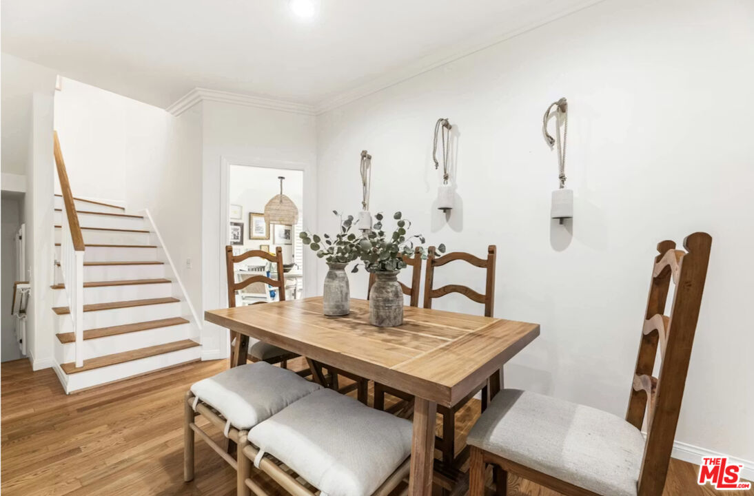 1108 18th Street, Unit 5 Santa Monica, CA 90403 - Photo 3 of 11 a view of a dining room with furniture and wooden floor