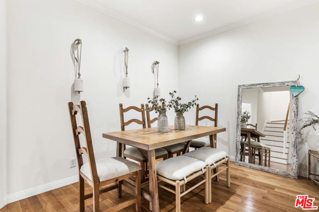 1108 18th Street, Unit 5 Santa Monica, CA 90403 - Photo 4 of 11 a dining room with furniture and wooden floor