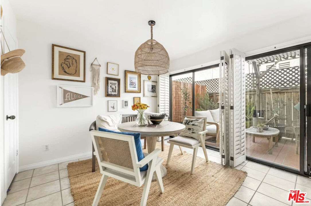 1108 18th Street, Unit 5 Santa Monica, CA 90403 - Photo 5 of 11 a view of a dining room with furniture window and outside view