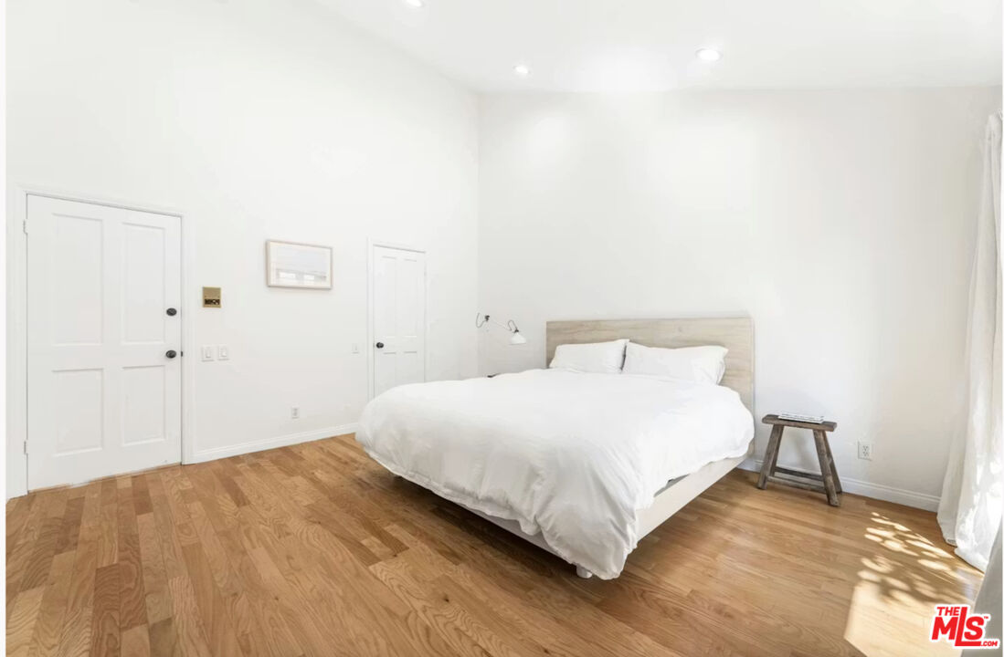 1108 18th Street, Unit 5 Santa Monica, CA 90403 - Photo 8 of 11 a large white bed in a white room