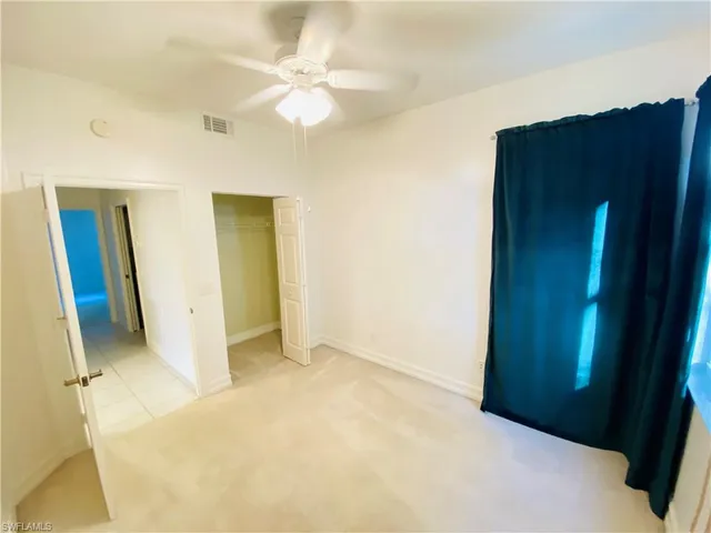 a view of a hallway with closet