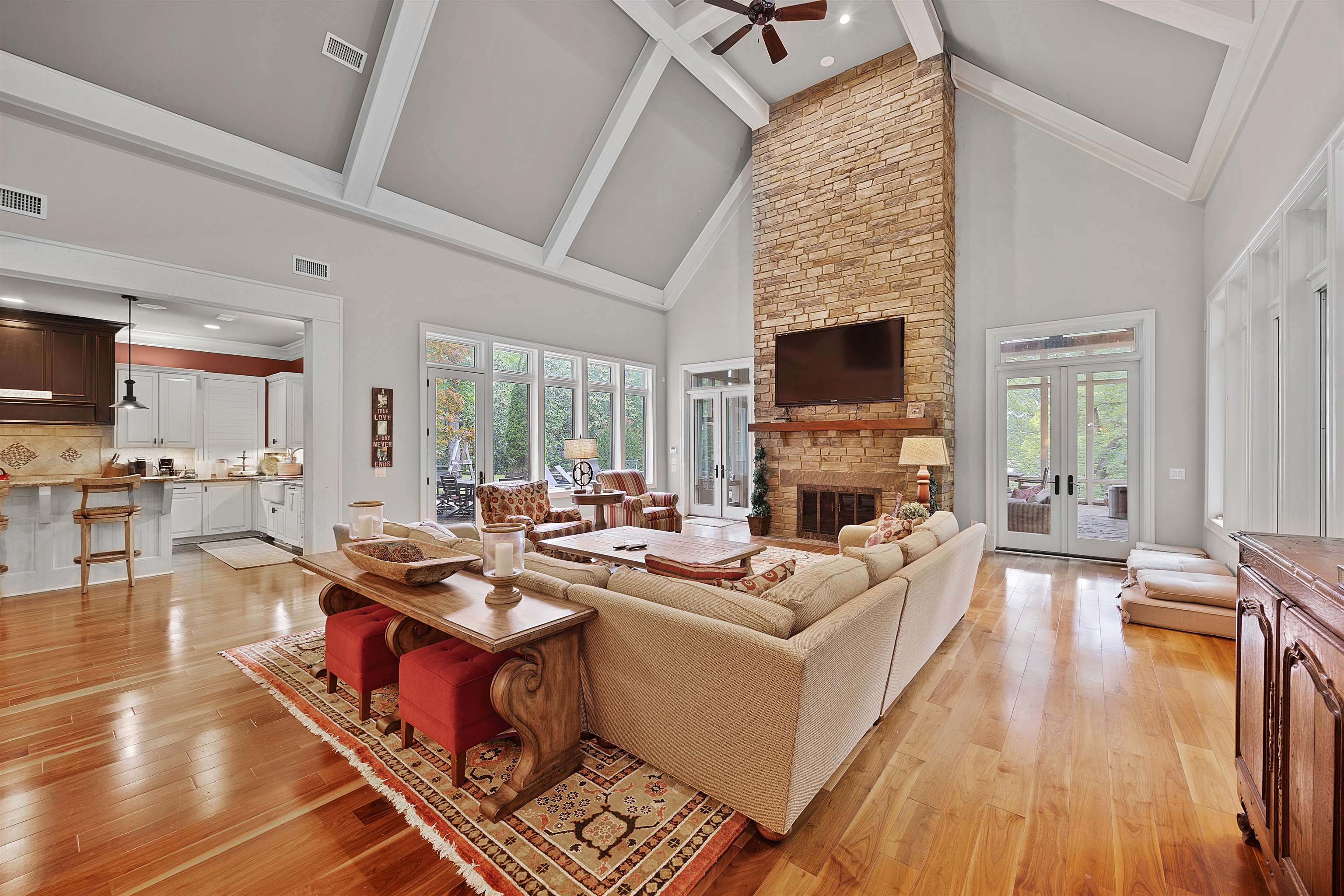 25 Caney Hollow Road Counce, TN 38326 - Photo 6 of 40 Living room with french doors, high vaulted ceiling, ceiling fan, beamed ceiling, and light wood-style flooring