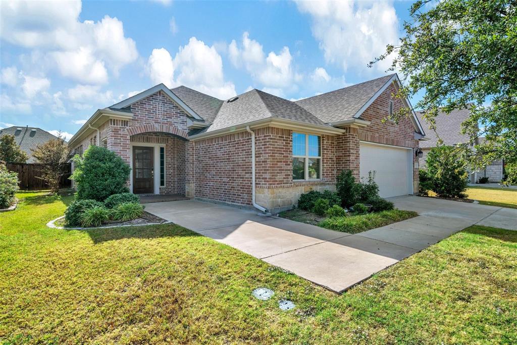 1605 Cedar Crest Drive Forney, TX 75126 - Photo 21 of 26 a front view of a house with garden