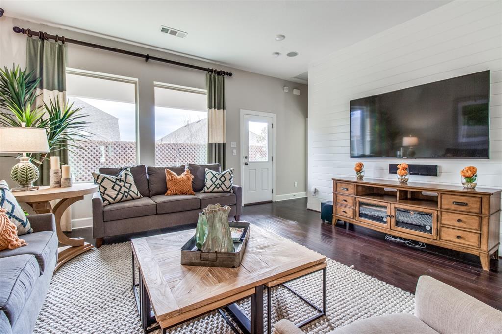 1605 Cedar Crest Drive Forney, TX 75126 - Photo 6 of 26 a living room with furniture and a flat screen tv