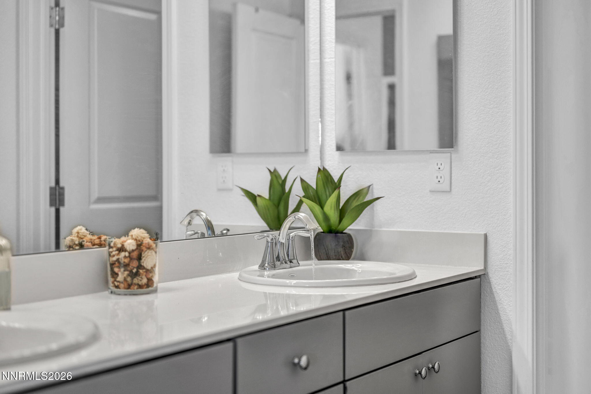 969 Estuary Circle Reno, NV 89506 - Photo 31 of 38 a bathroom with a granite countertop sink and a mirror