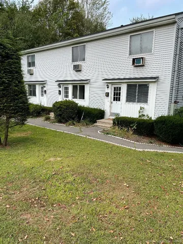 a front view of a house with swimming pool