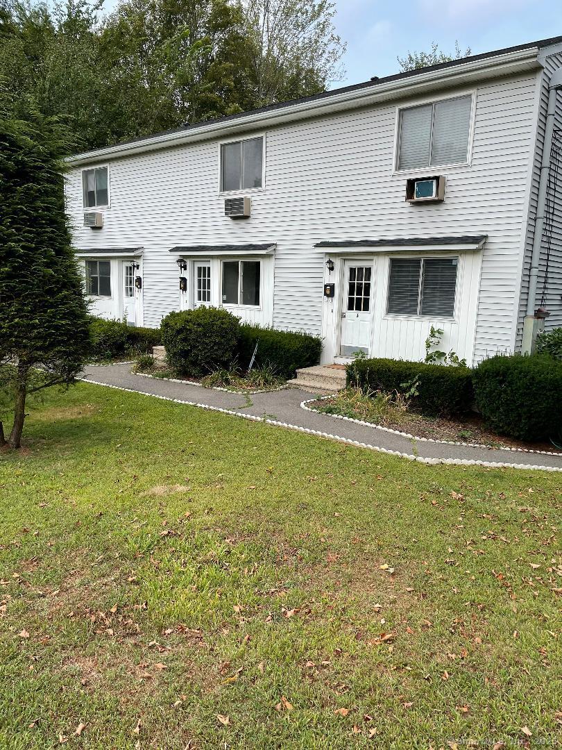 a front view of a house with swimming pool