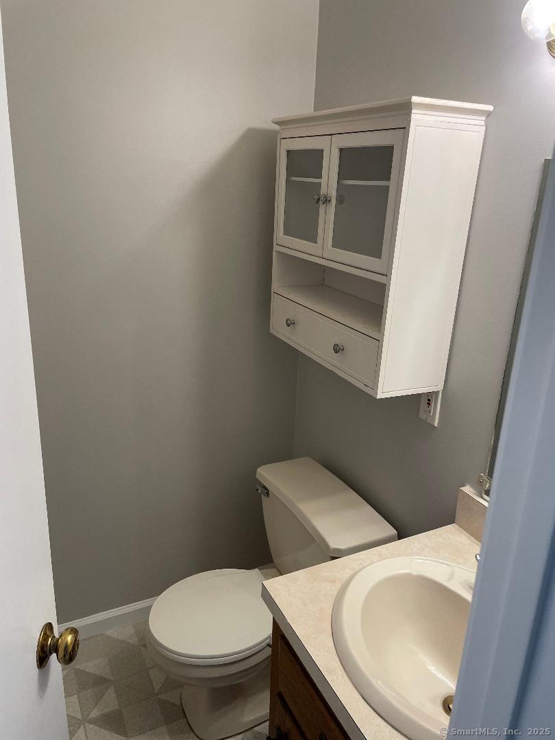 155 Unit 2 Bristol Street Thompson, CT 06277 - Photo 6 of 18 a white toilet sitting next to a sink