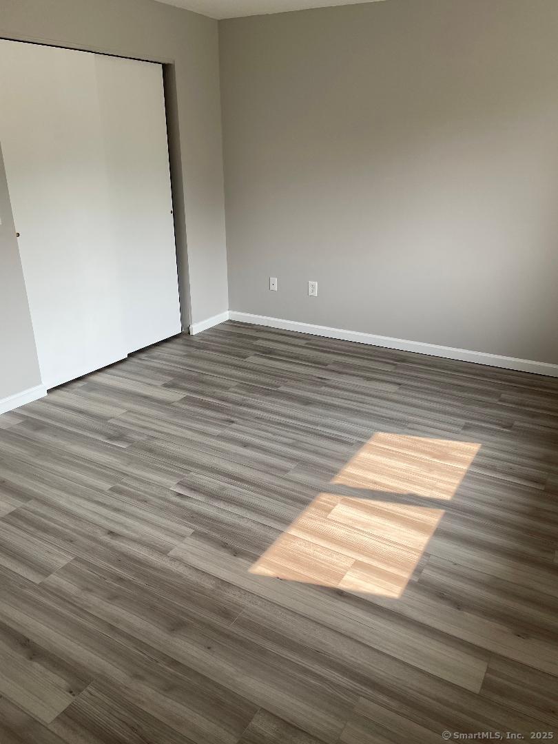 155 Unit 2 Bristol Street Thompson, CT 06277 - Photo 8 of 18 a view of empty room with wooden floor