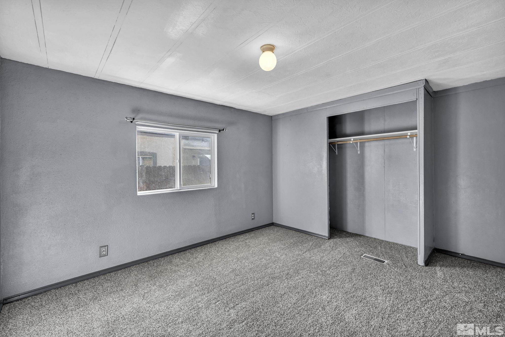 4770 Rampion Way Sun Valley, NV 89433 - Photo 12 of 17 a view of an empty room with a window