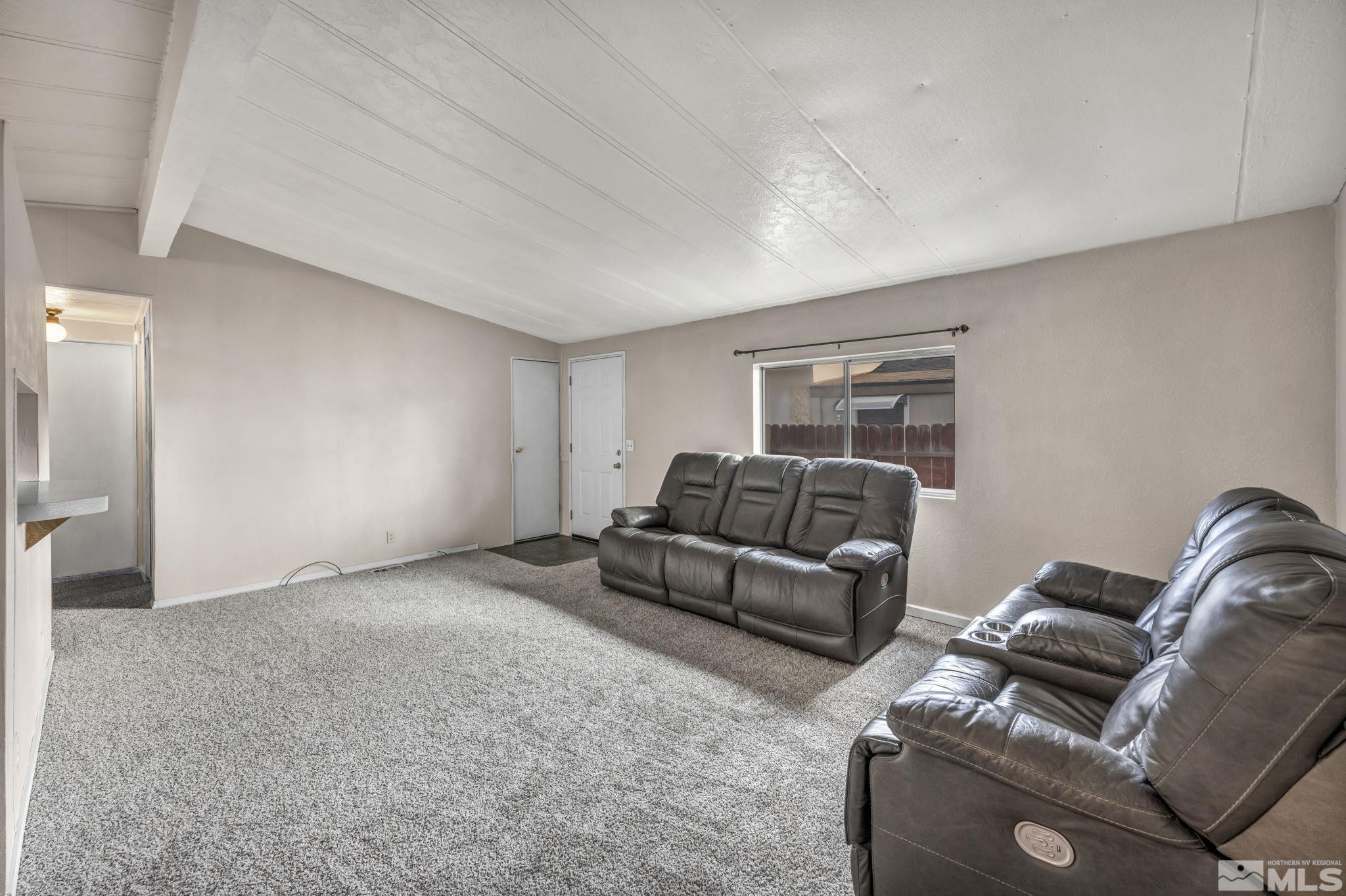 4770 Rampion Way Sun Valley, NV 89433 - Photo 5 of 17 a living room with furniture