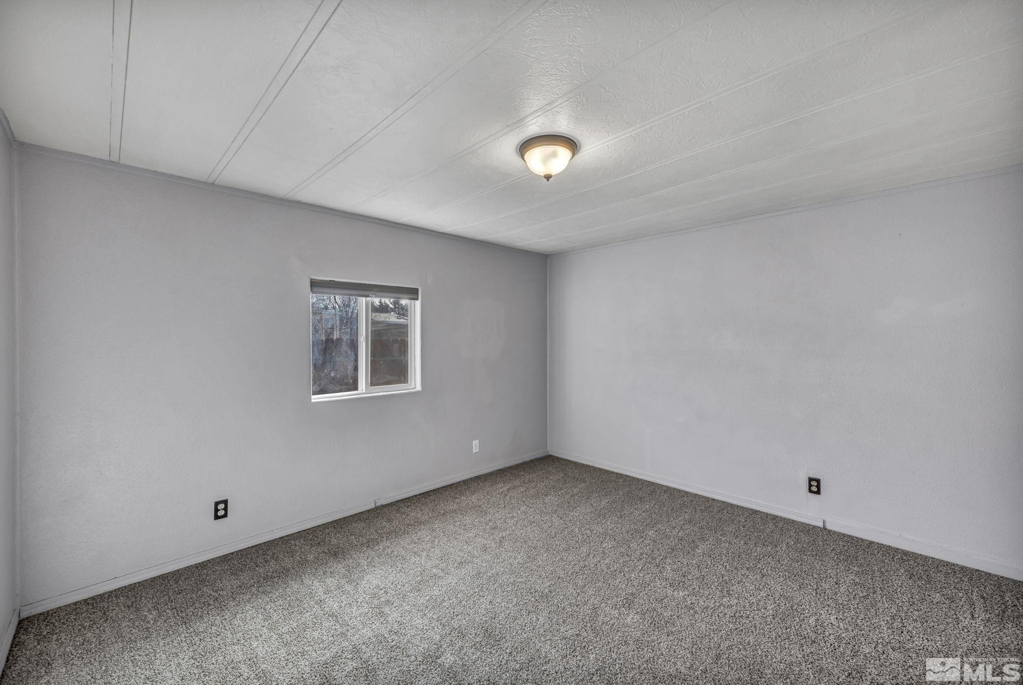 4770 Rampion Way Sun Valley, NV 89433 - Photo 9 of 17 an empty room with a window