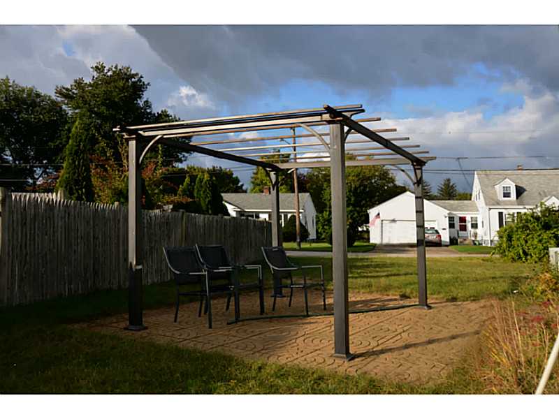 229 Mapleton Street Cranston, RI 02910 - Photo 3 of 9 Patio/Deck. Custom stone patio with large arbor, fenced back.