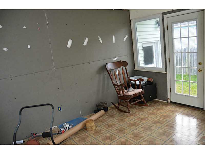 229 Mapleton Street Cranston, RI 02910 - Photo 7 of 9 Mud Room. Mudroom/breezeway with new doors front and back and new windows. Drywall is up and needs finishing.