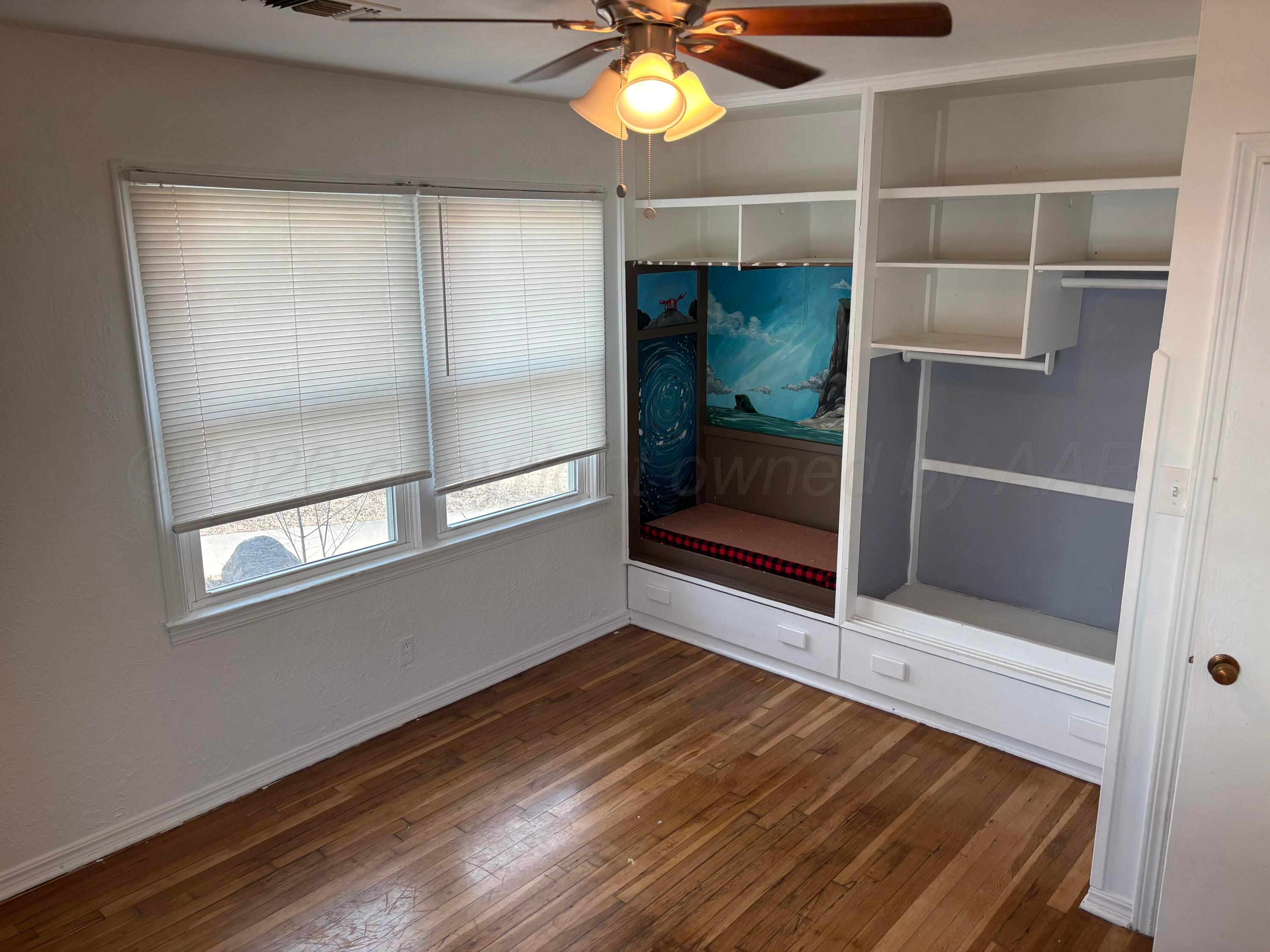 4014 Cline Road Amarillo, TX 79110 - Photo 14 of 21 a view of an empty room with a window