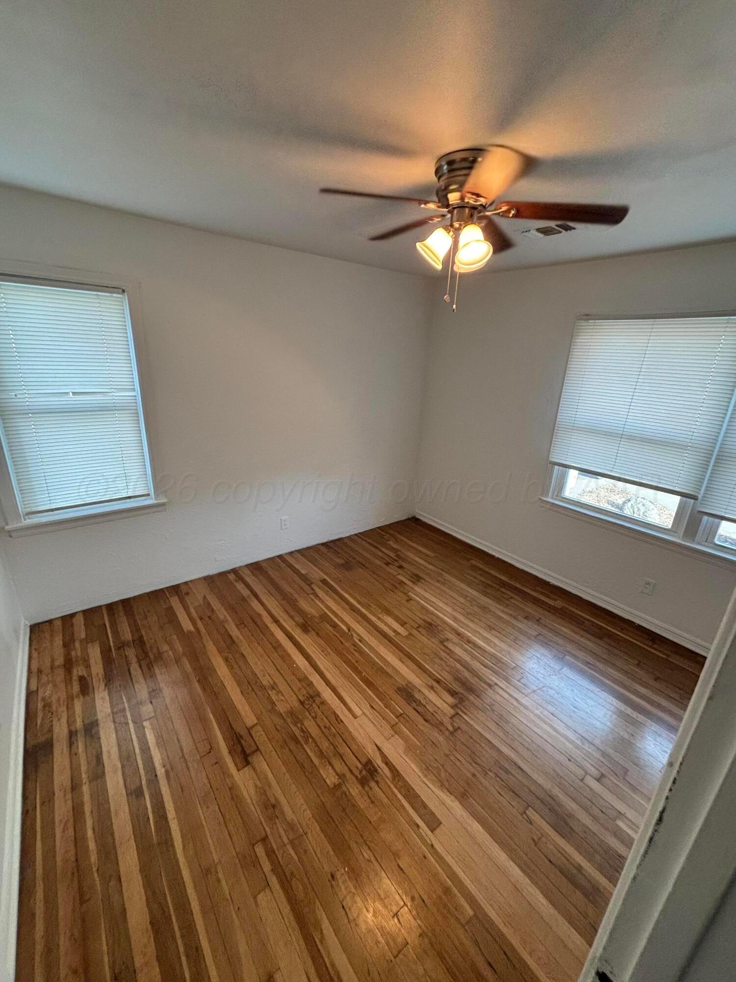 4014 Cline Road Amarillo, TX 79110 - Photo 15 of 21 a view of a room with a ceiling fan and a window