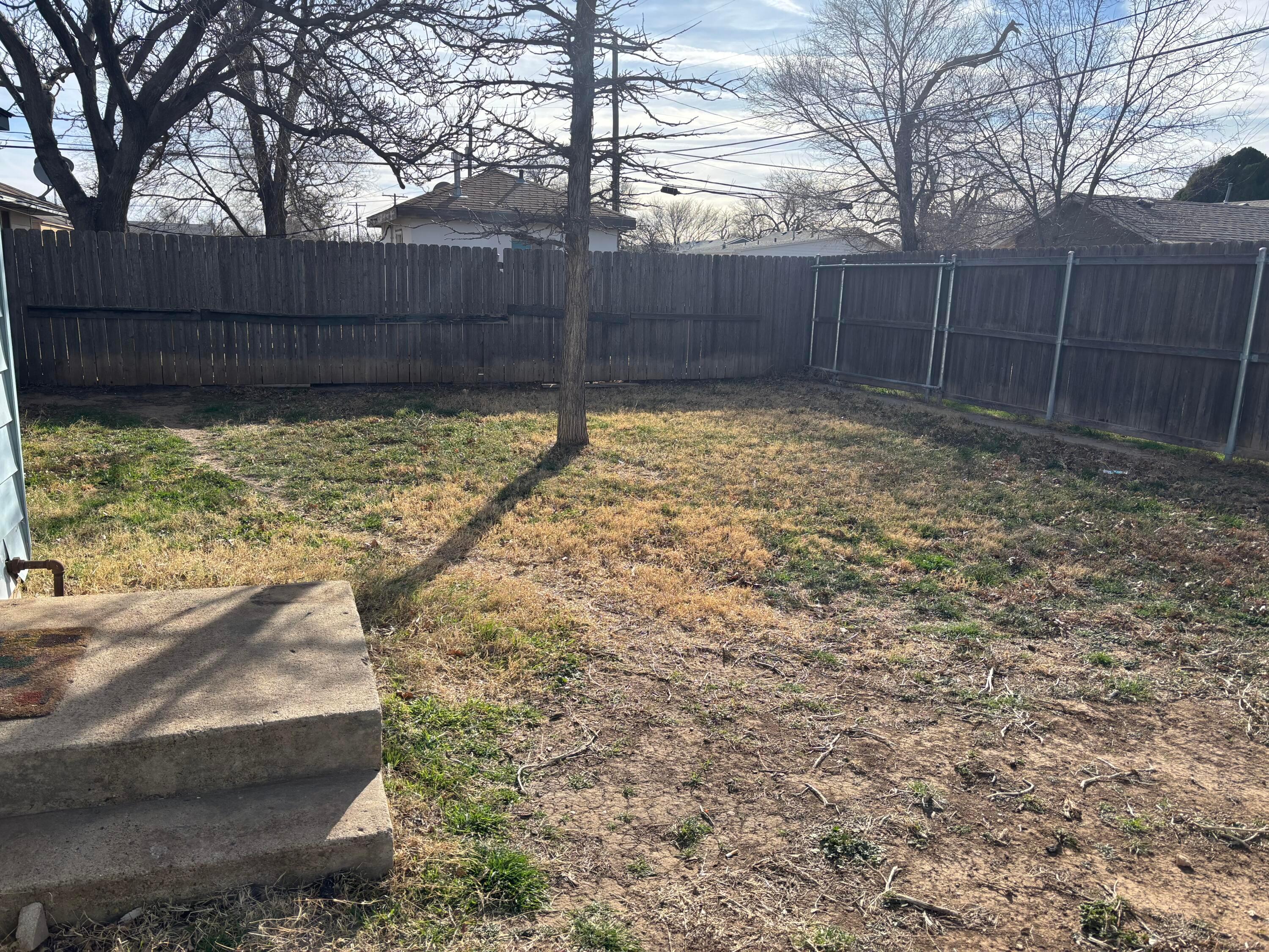 4014 Cline Road Amarillo, TX 79110 - Photo 19 of 21 a view of backyard with wooden fence