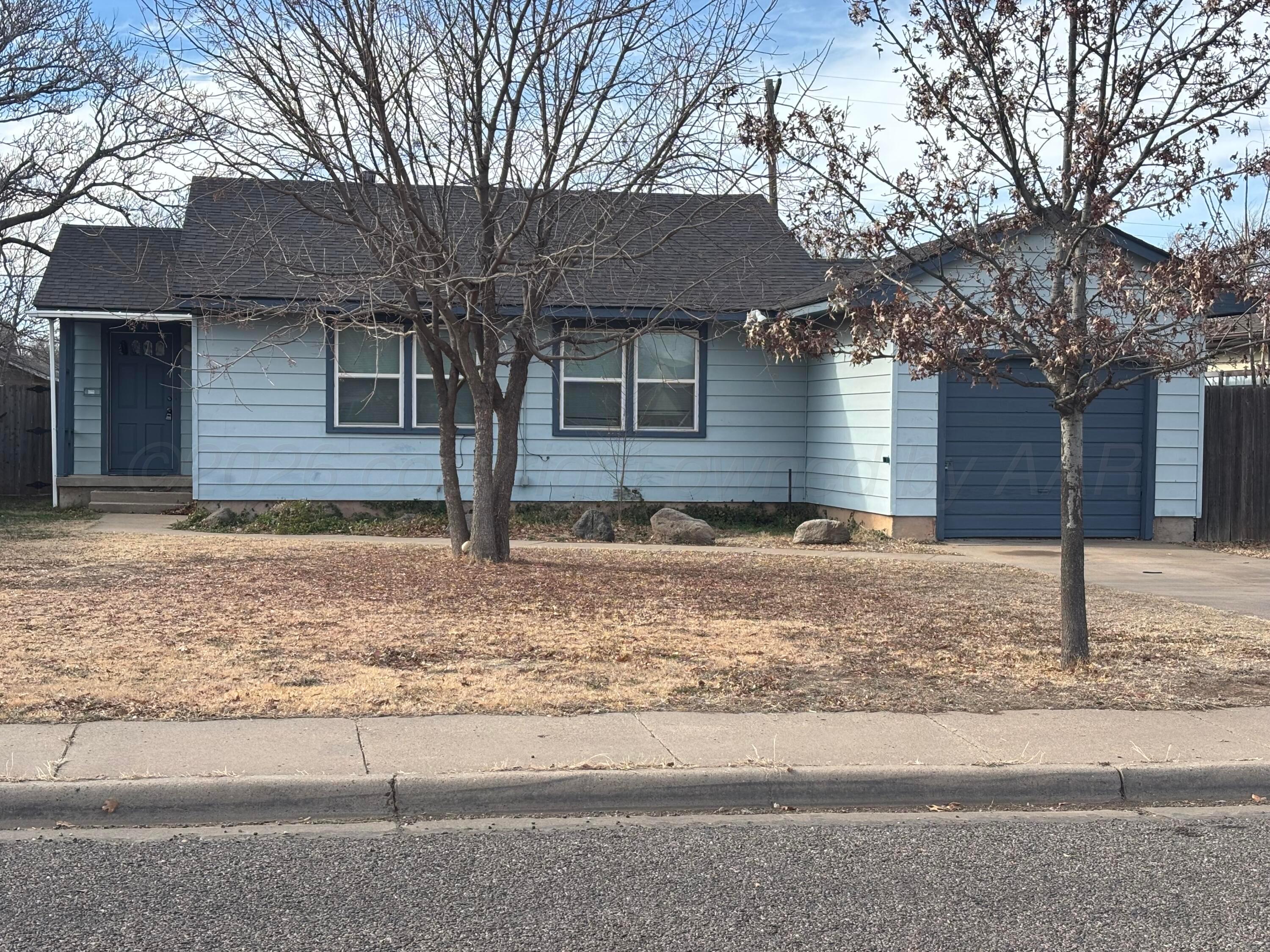 4014 Cline Road Amarillo, TX 79110 - Photo 21 of 21 a front view of a house with garden